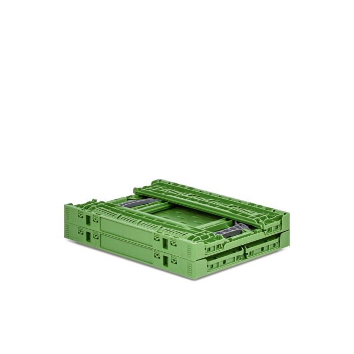 Zusammengeklappte grüne Klappbox Verdura mit durchbrochenen Seitenwänden und perforiertem Boden